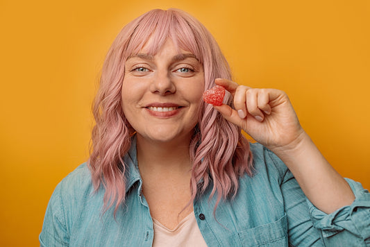 Happy woman enjoying a Delta 9 gummy
