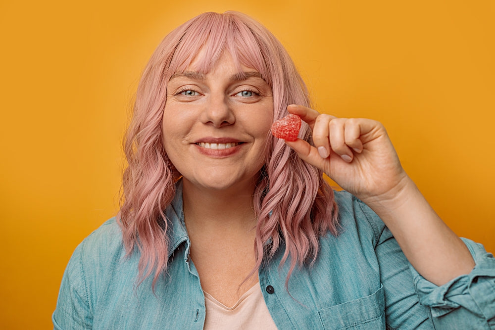 Happy woman enjoying a Delta 9 gummy